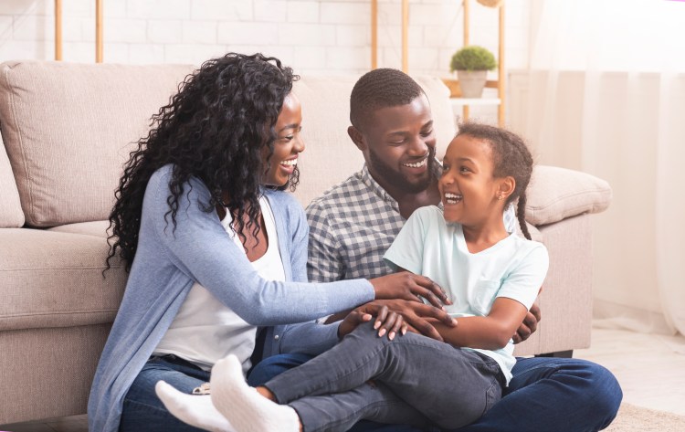 A photo of a family laughing