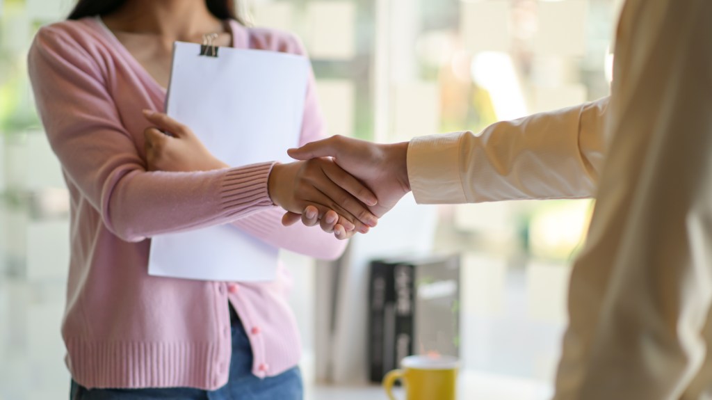 a photo of two people shaking hands